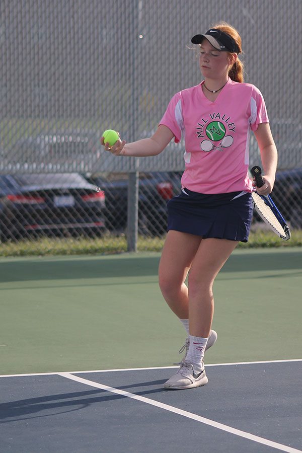 Sophomore Josie Carey catches a ball that was out of bounds. 