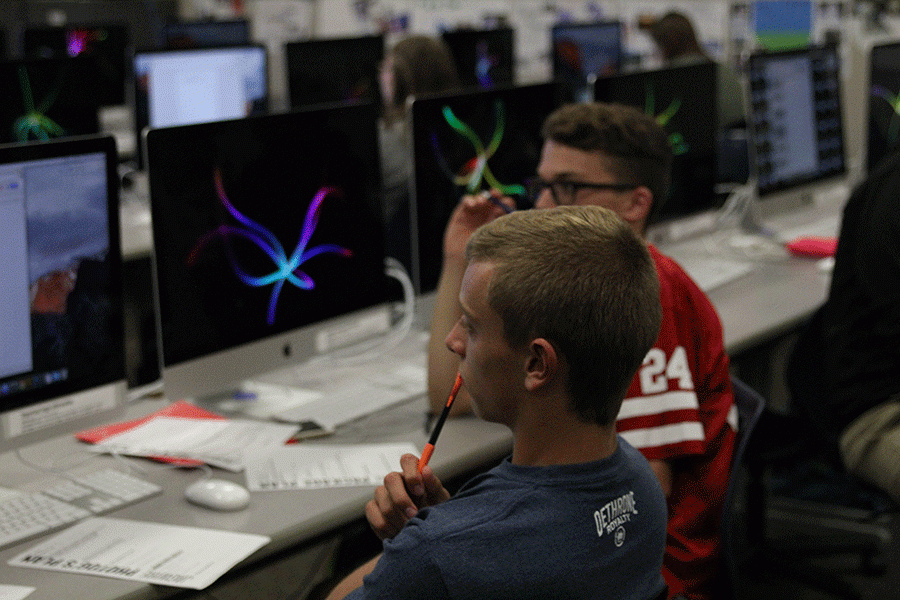 During newspaper, junior Carter Lawson works on the Mac.