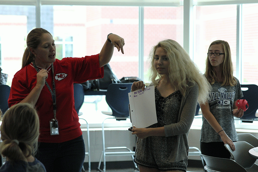 President Emma Wilhoit and Mrs.Appl introduce Mv Outreach to new staff memebers and make paper pumpkins on Friday, Sept.9. 