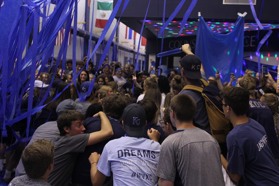 Senior Spencer Butterfield leads a dance after mass decoration Friday morning