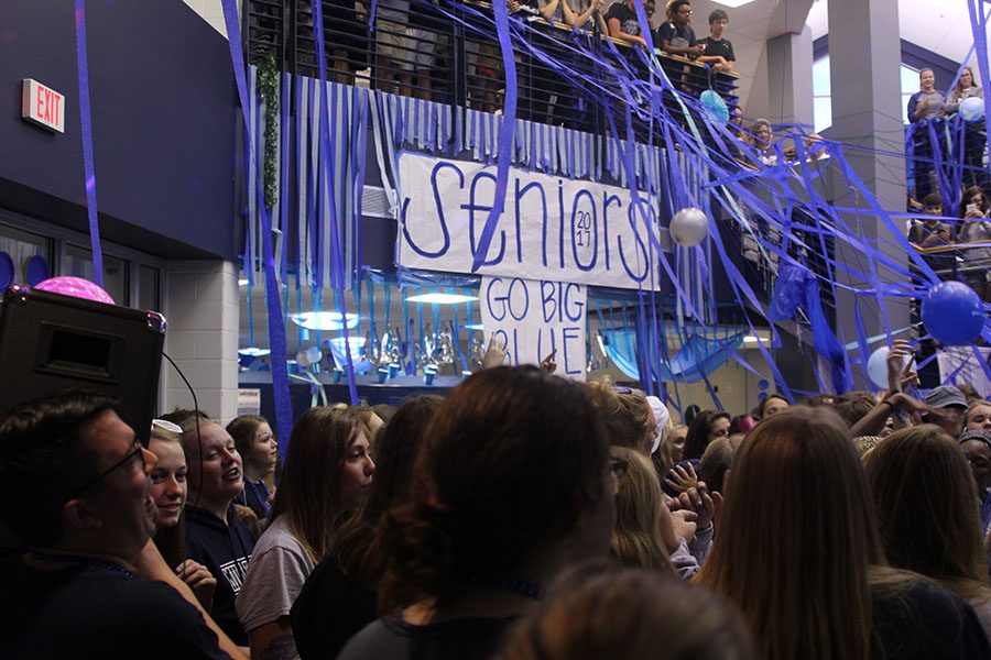 Seniors dance Friday morning after decorating the foyer.