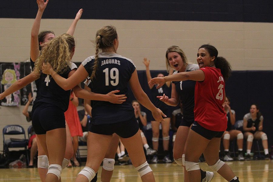 Sophomore Sydney Pullen celebrates with her teammates after scoring to tie the set.