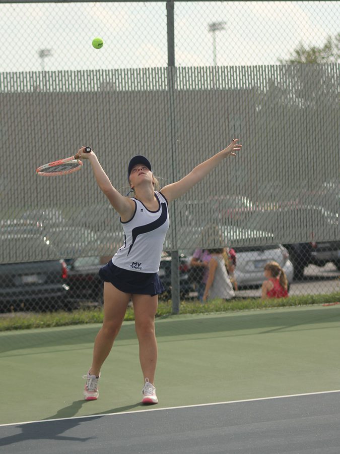 Keeping her eye on the ball, senior Sarah Anderson prepares to hit the ball across the court.