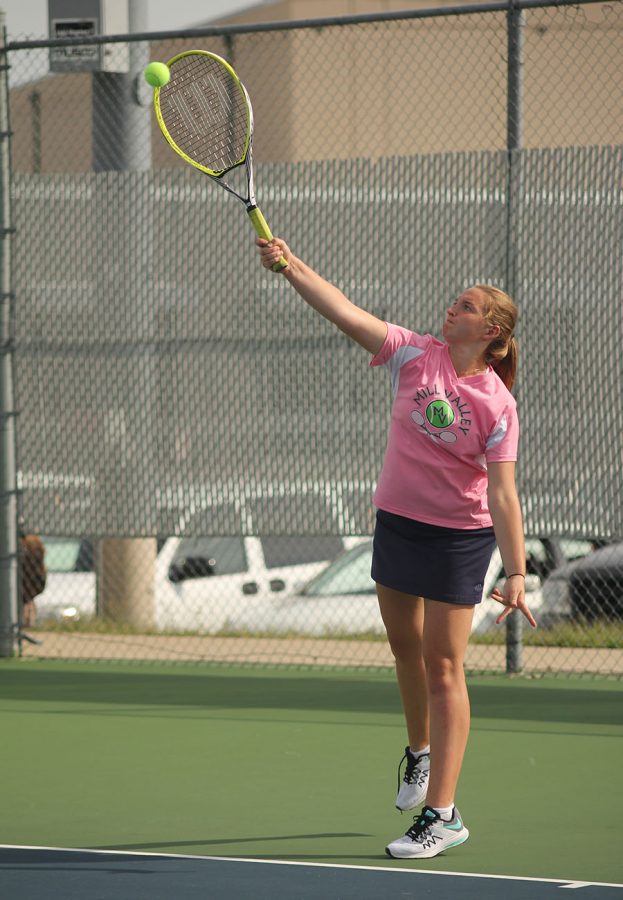 Senior Grace McGill hits the ball back to her opponent.