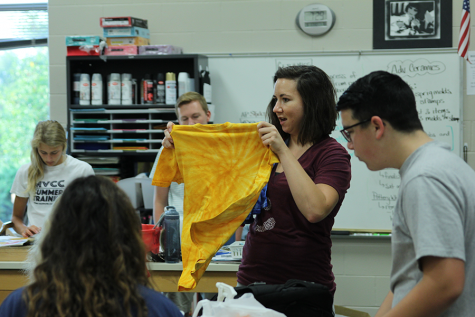 Stuco sponsor Erica Crist holds up a freshman homecoming t-shirt.