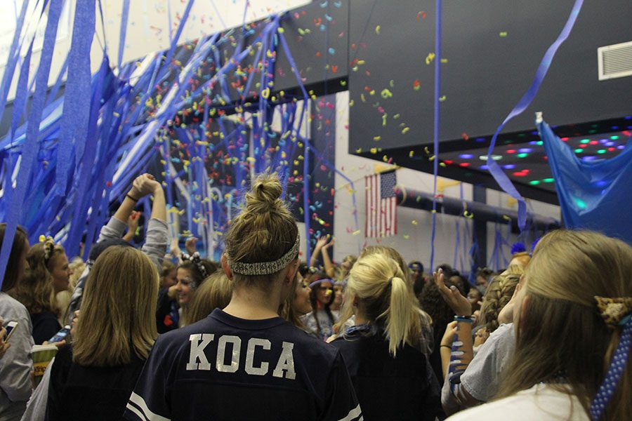 As+senior+Mallory+Koca+stands+in+the+crowd%2C+confetti+erupts+around+her.