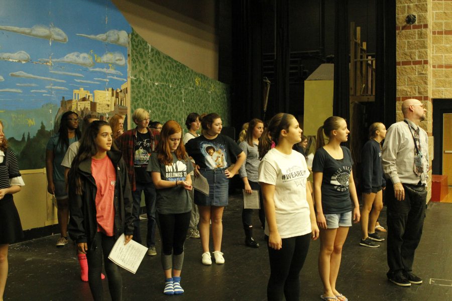 Hello Dolly dancers watch Drama teacher Jon Copeland as he shows them to steps to Hello Dolly.