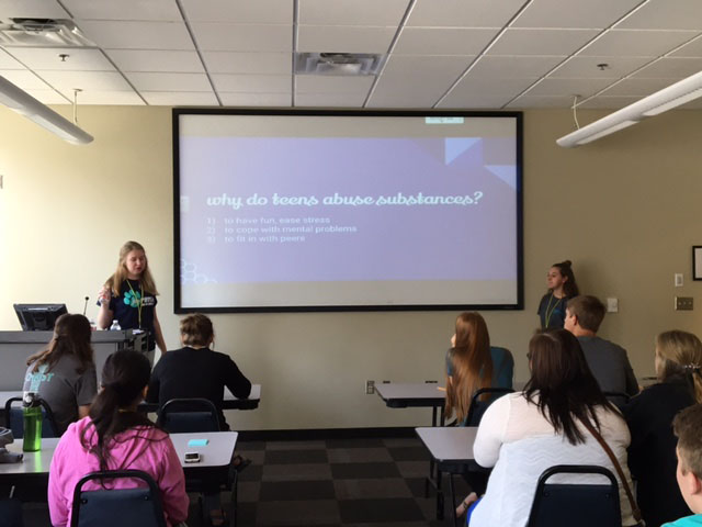 Senior Mary Petropoulos and sophomore Jessica Coleman present at the Youth Leadership Summit conference on Thursday, Sept. 1. "[The conference] teaches different organizations in different schools techniques they can use to make their programs better and to be better leaders," Petropoulos said.