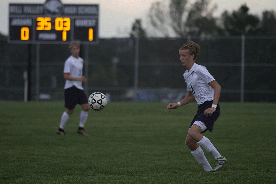 With the Saints heading towards him, senior Spencer Butterfield waits to receive the ball.