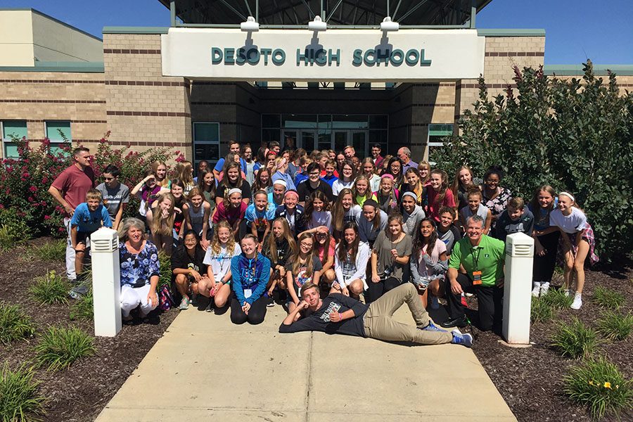 Students stand with middle school publications students and teachers at the workshop outside De Soto High School on Monday, Sept. 12.