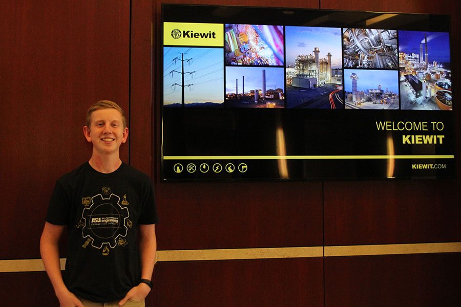 Junior Landon Butler stands in front of a slideshow at Kiewit Engineering and Design on Thursday, Oct. 20. Engineers face problems on a day to day basis and it’s always new and it’s always fresh so you’re not doing the same thing every day, Butler said. You get to combine your skills in math in science, which is what I’m really good at, and you get to see how that works on a career level.