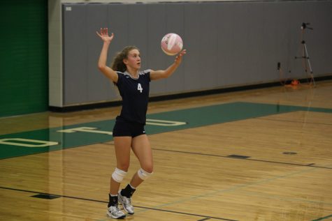 Up to serve, senior Morgan Thomas stays at the serving line for three plays while the Jaguars continue to rack up points.