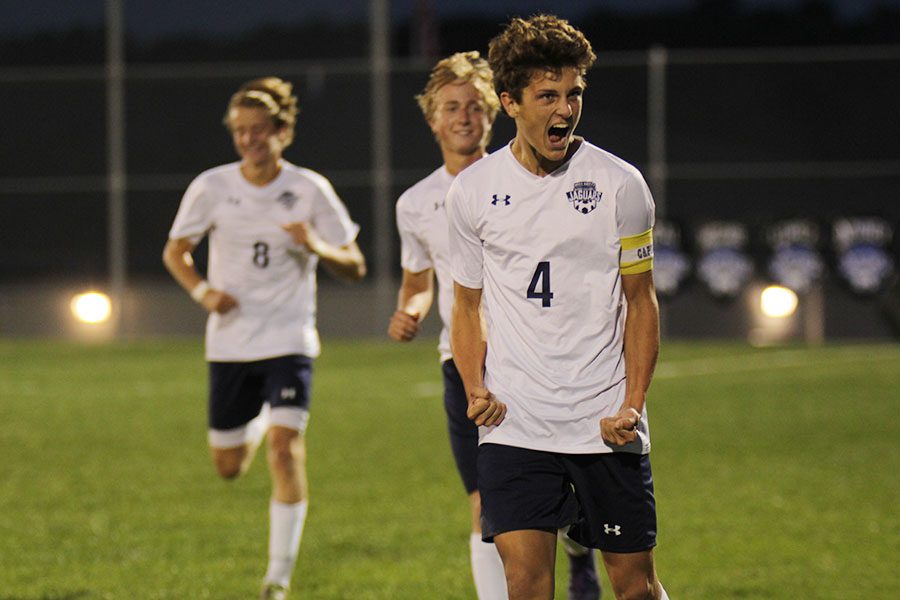 Senior Adam Grube cheers after scoring a goal for Mill Valley