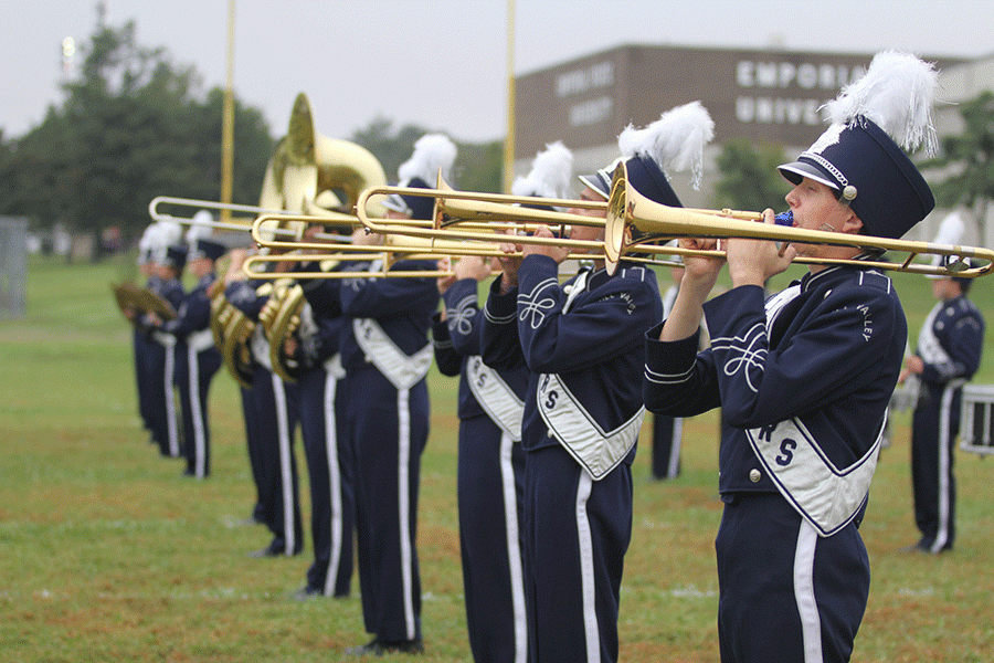 Senior Conner Davis warms up his trombone at the Emporia State marching festival on Wednesday, Oct. 5.
