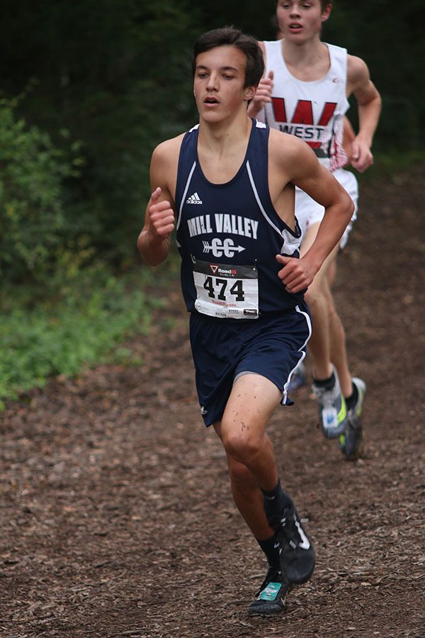 Running ahead of his opponent, freshman Jack Terry races to secure his 23rd place finish.