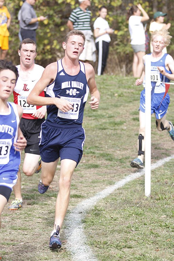 Senior Max Jones stays ahead of his competitors while rounding a corner before placing 55th.