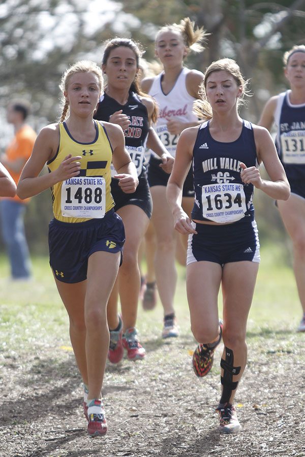 Junior Britton Nelson nears the front of the runners within the first mile of the race.