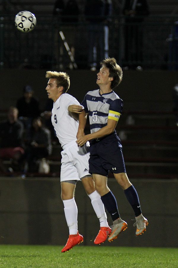 Senior Hayden Vomhof heads the ball.