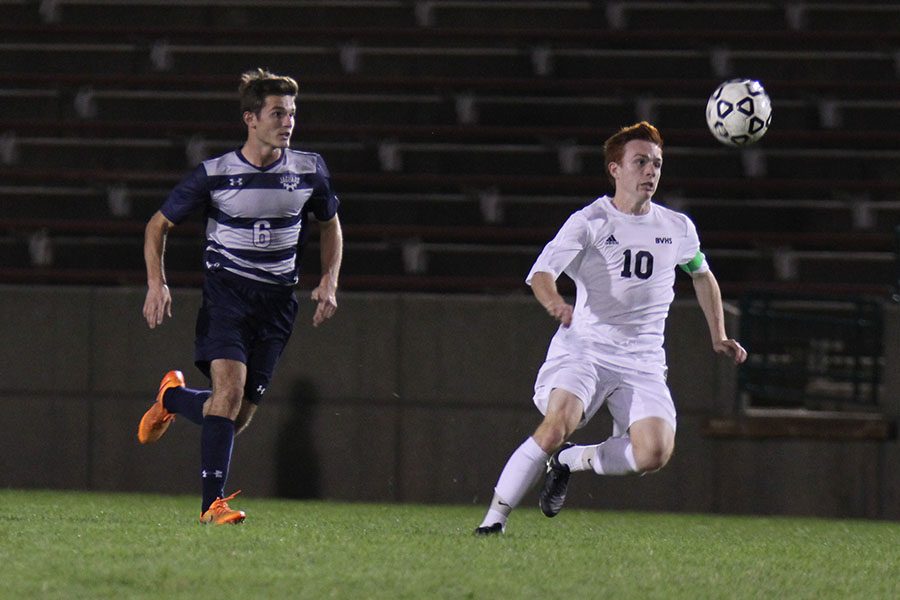 Senior Sam Lopez races towards the ball.