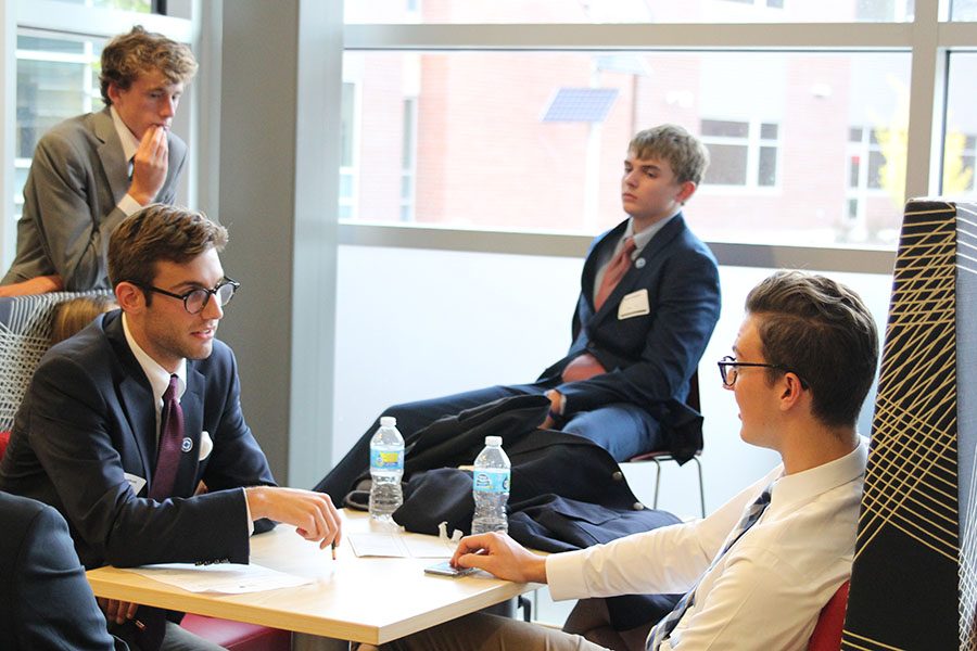 On Oct. 11, seniors Jack Campbell and Ethan Hansen discuss their events at the DECA competition