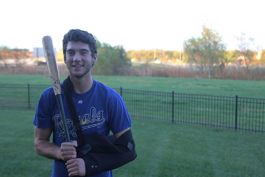 With his arm in a sling on Sunday Oct 16th, senior Luke Sosaya holds his baseball bat. I was sad that I was going to miss the fall baseball season, but the recovery wont be too bad. Sosaya sad.