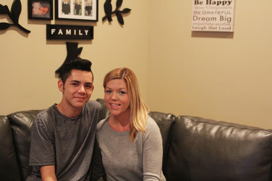 Sitting in his living room with his mom on Wednesday, Oct. 18, sophomore Dominic says, 
