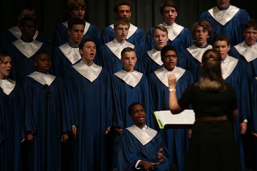 With the direction of choir teacher Stephanie Mooneyhan, the mixed choir sings during their first concert of the year on Thursday, Oct. 13.