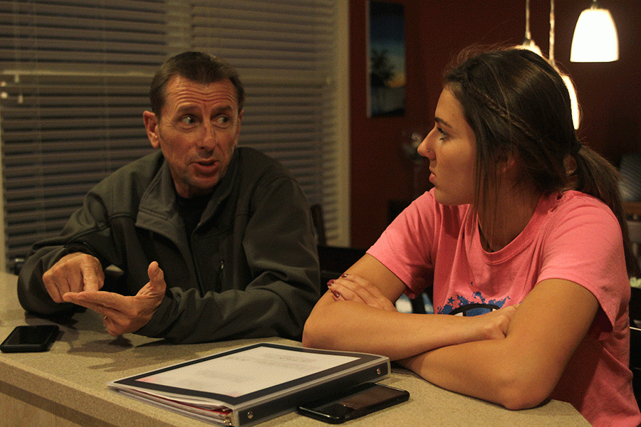 Nodding+along+with+her+dad%2C+junior+Maci+Montee+discusses+politics+at+the+dinner+table.