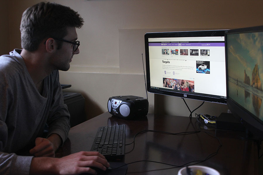 Senior Jack Campbell reads from Bloomberg News on Wednesday, Oct. 12.