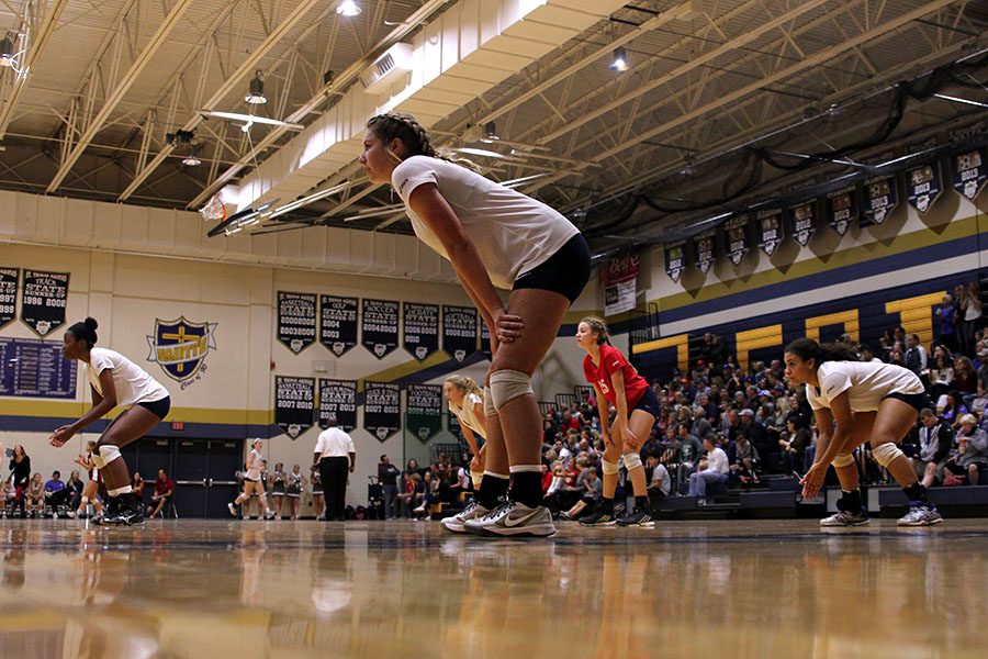 While waiting for their opponents to serve, the team prepares on Saturday, Oct. 22. The Jaguars beat Sumner Academy but fell to St. Thomas Aquinas in the second round.  