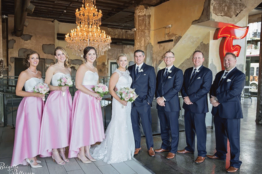 Having been friends for eight years, art teacher Erica Crist (third left) was a bridesmaid in math teacher Jessica DeWild’s (center left) wedding on Friday, Oct. 21.