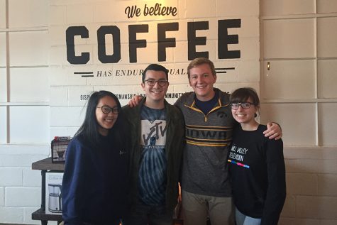 Seniors Sue Kim, Collin Petigna, Brady Roling and Dana Schath participate in a group photo at their last DUTV event on Saturday, Nov. 5.