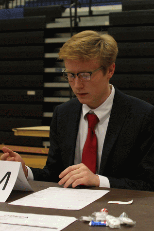 While competing in the role playing section, junior Ryan Ballard explains an idea to his interviewer.