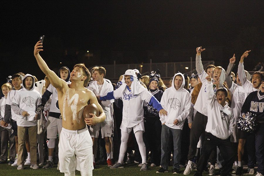 After the games completion, junior Conner Ward shoots a quick selfie with the rest of the student section.