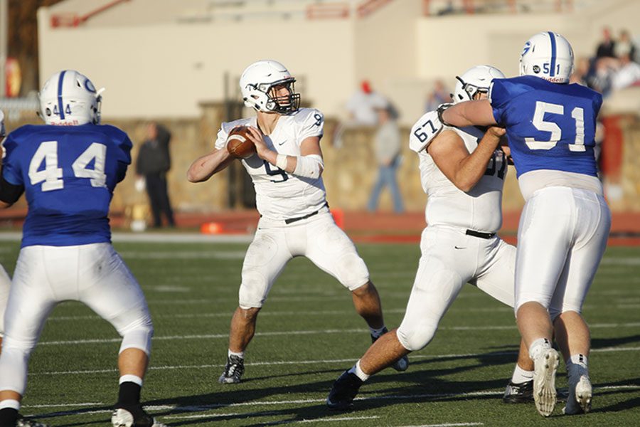 In overtime, junior Brody Flaming looks to throw the ball to a wide receiver.
