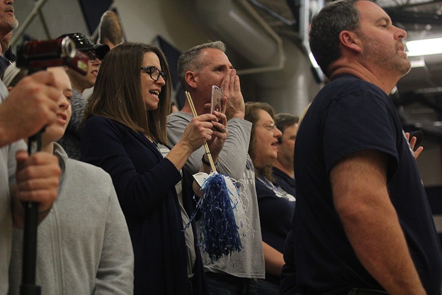 Sophomore Cameron Youngs parents participate in a chant at the football pep rally that was held on Friday, Nov. 25. You definitely think they have an opportunity to compete but going into a new league, especially the EKL where you’re challenged night in and night out, it’s absolutely a grind, Scott Young said. You got bumps and bruises and injuries, things that the boys have to try and overcome. They’ve had a difficult road this year but they’ve been able to overcome all that and been able to accomplish almost all their goals that they’ve set forth for themselves.