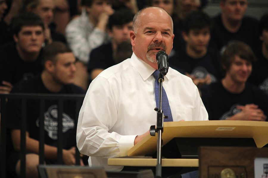 During the state football pep assembly, principal Tobie Waldeck introduces mayor Michelle Distler.