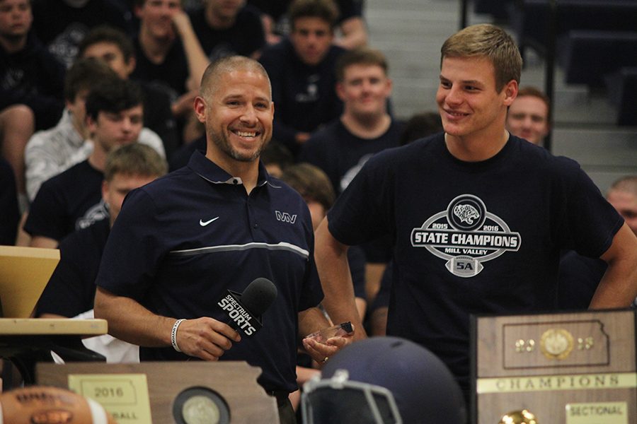 At+the+pep+assembly+on+Tuesday%2C+Nov.+29%2C+head+football+coach+Joel+Applebee+helps+award+junior+Brody+Flaming+as+Student+Athlete+of+the+Week.