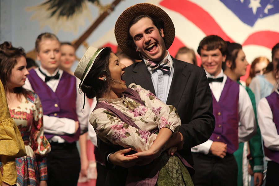 After the dress rehearsal, senior Natalie Carrera and junior Simon Stewart bow during curtain call.