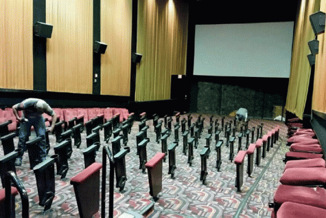 Construction workers remove seat paddings from the frames in a B&B auditorium during renovations that took place this fall.