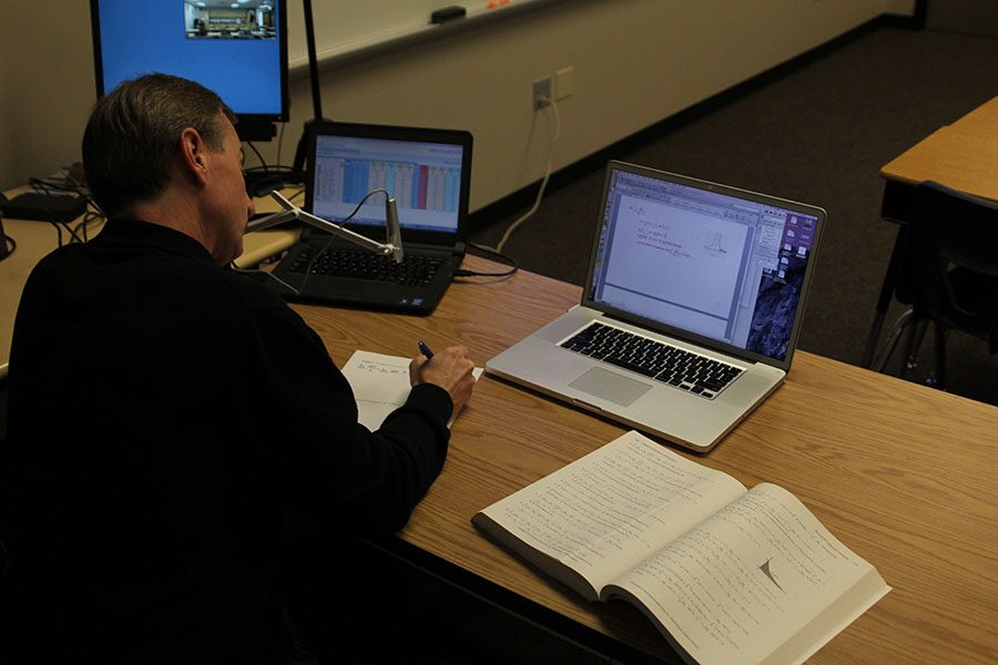 Math teacher Brian Rodkey uses a web cam to broadcast his notes to both students in his classroom and to students at DHS.