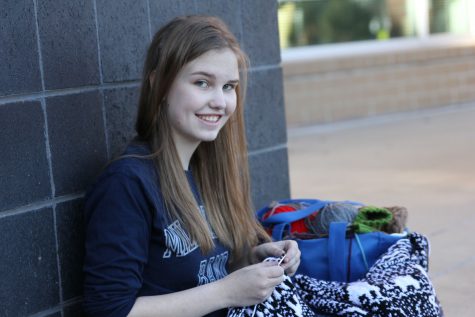 In order to continue knitting during school, junior Marissa Olin learned how to knit without looking at her product. "I learned during freshman year, just to spite people who said I couldn't."