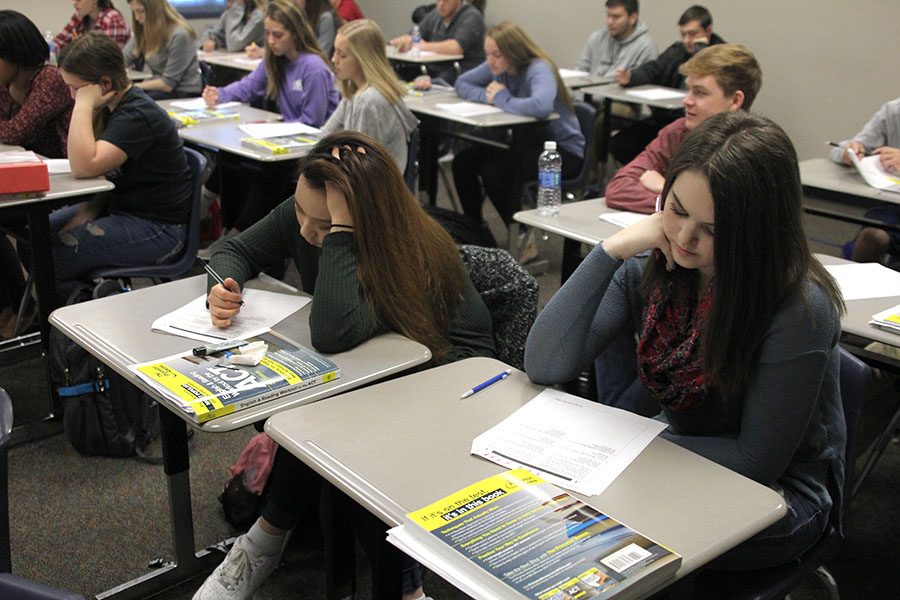 In their ACT Prep class, seniors Hannah Brady and Seohee Shin participate in a class discussion as they review their answers after taking a practice test on Monday Nov. 28.