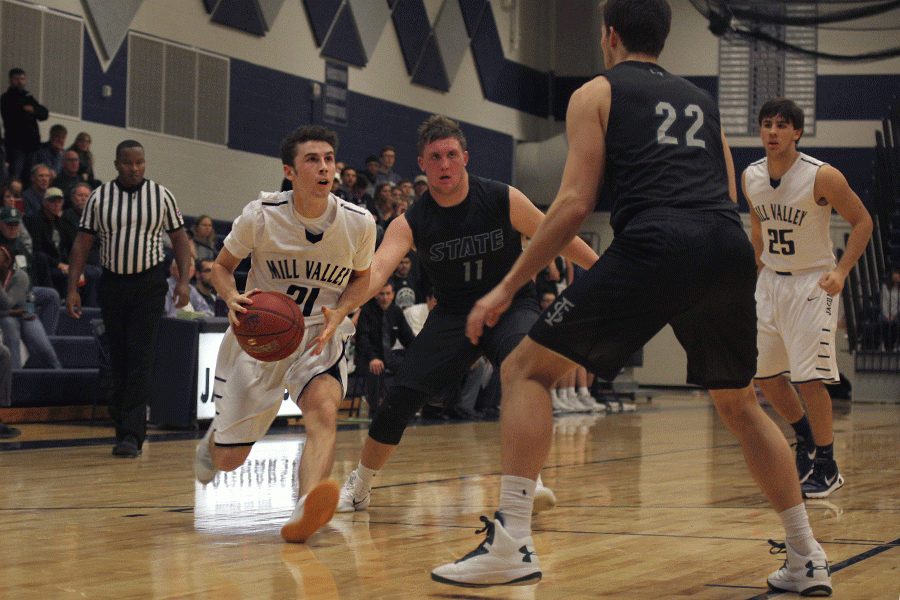 Going for a layup, senior Blake Montgomery looks at the basket on Friday, Dec. 9. The Jaguars fell to Lawerence Free State 68-60.