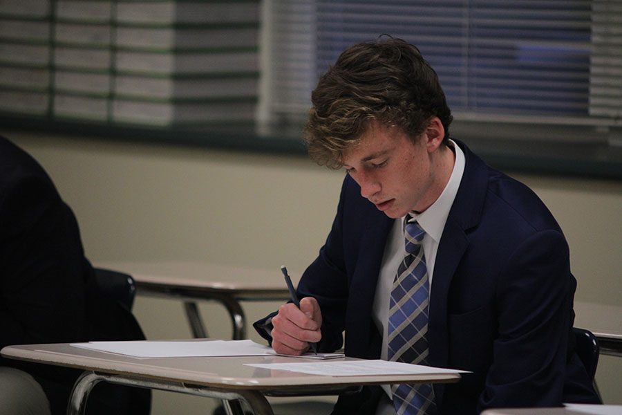 Preparing for roleplay, senior Jakob Coacher organizes his ideas on Wednesday, Jan. 11.