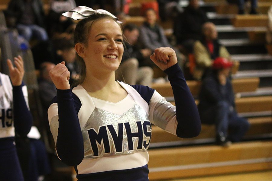 Senior Brianna Duden cheers on the team.