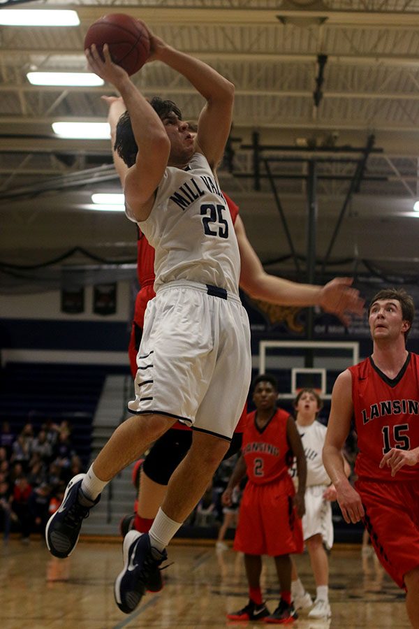 Junior Ike Valencia jumps for a basket.