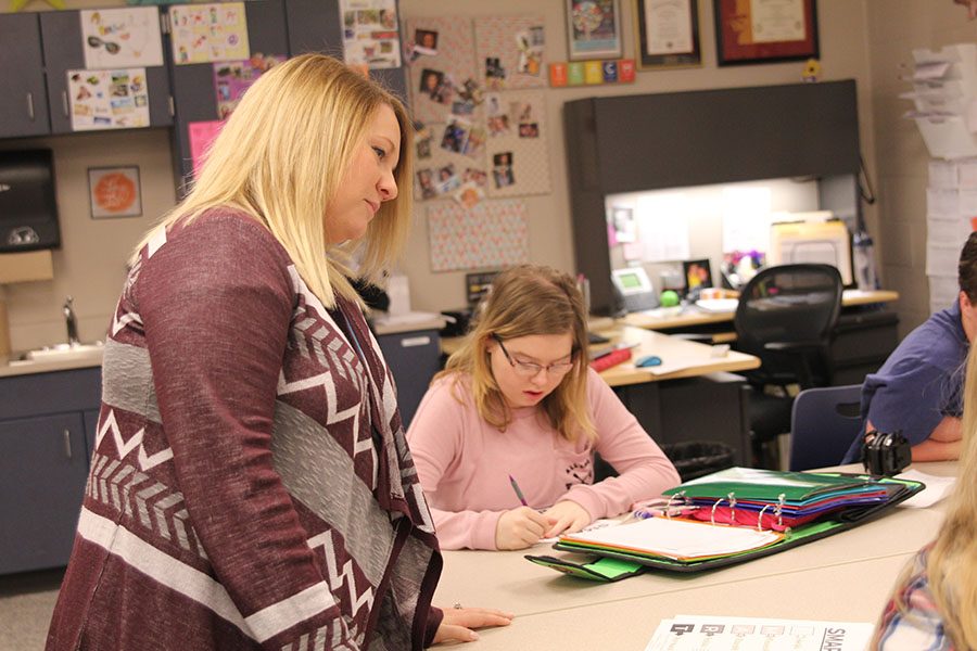 Family and Consumer Sciences teacher Emily Schmidt observes her students as she teaches them SMART goals, which are life planning skills.