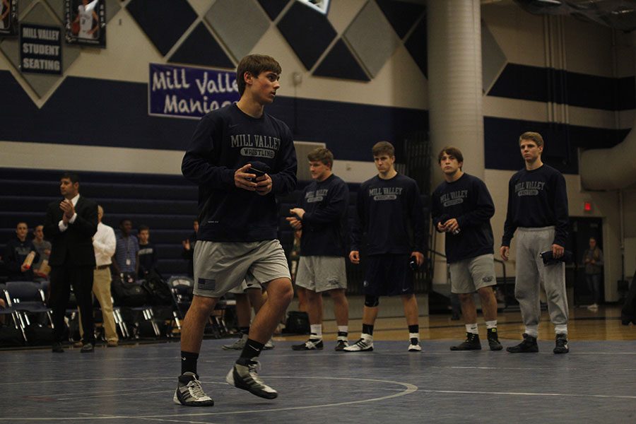 Senior Austin Crocker prepares to throw a t-shirt to the student section. 