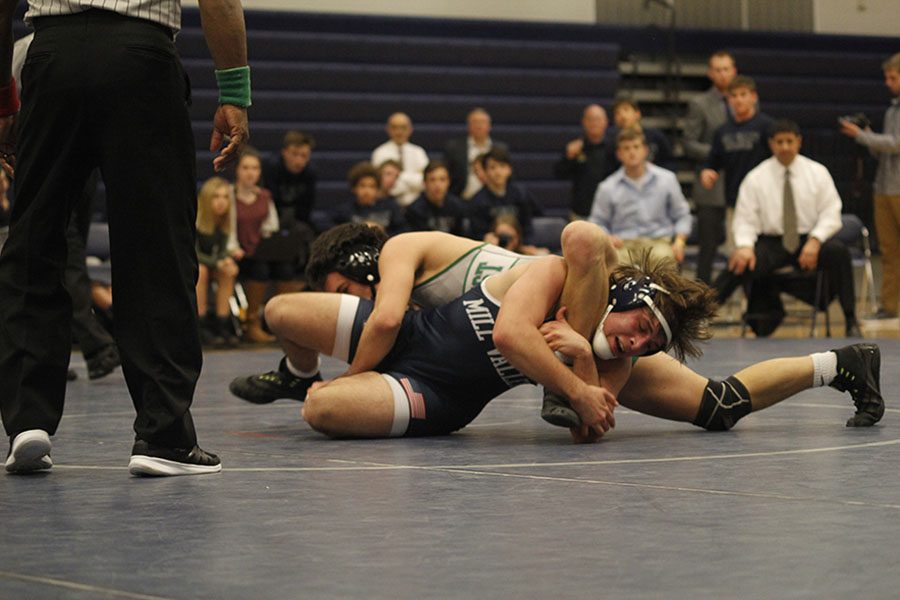 Junior Hayden Koepke struggles to reverse his opponent. 